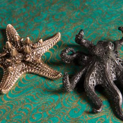 Pewter cast objects of an octopus and starfish